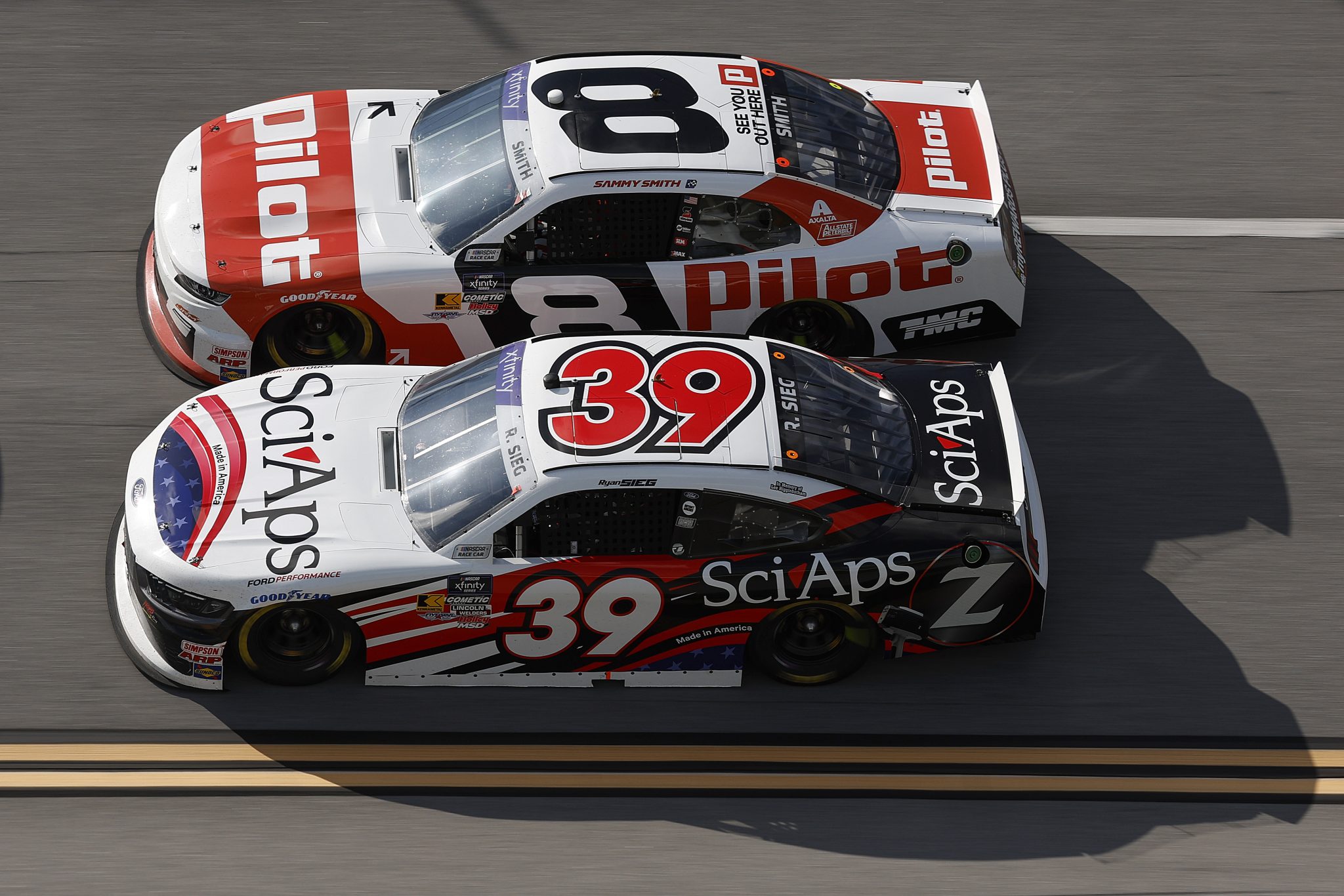 TALLADEGA, ALABAMA - APRIL 26: Ryan Sieg, driver of the #39 Sci Aps Ford, and Sammy Smith, driver of the #8 Pilot Chevrolet, race during the NASCAR Xfinity Series Ag-Pro 300 at Talladega Superspeedway on April 26, 2025 in Talladega, Alabama. (Photo by Sean Gardner/Getty Images) | Getty Images