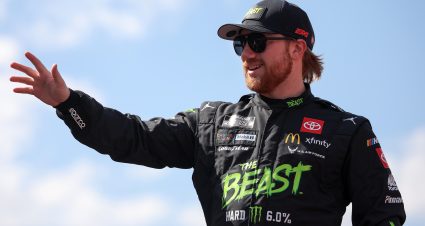 AUSTIN, TEXAS - MARCH 02: Tyler Reddick, driver of the #45 The Beast Toyota, waves to fans as he walks onstage during driver intros prior to the NASCAR Cup Series EchoPark Automotive Grand Prix at Circuit of The Americas on March 02, 2025 in Austin, Texas. (Photo by James Gilbert/Getty Images) | Getty Images