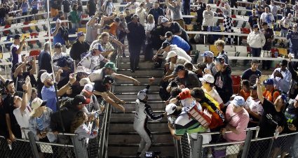 CONCORD, NORTH CAROLINA - MAY 25: Ross Chastain, driver of the #1 Jockey x Folds of Honor Chevrolet, celebrates with fans in the grandstands after winning  the NASCAR Cup Series Coca-Cola 600 at Charlotte Motor Speedway on May 25, 2025 in Concord, North Carolina. (Photo by Logan Riely/Getty Images) | Getty Images