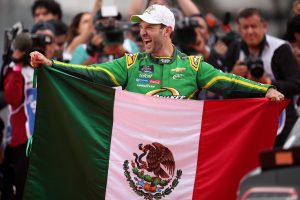 MEXICO CITY, MEXICO - JUNE 14: Daniel Suarez, driver of the #9 Quaker State Chevrolet, celebrates with the Mexican flag after winning the NASCAR Xfinity Series The Chilango 150 at Autodromo Hermanos Rodriguez on June 14, 2025 in Mexico City, Mexico. (Photo by James Gilbert/Getty Images) | Getty Images