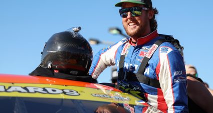 CONCORD, NORTH CAROLINA - MAY 23: Garrett Mitchell, also known as Cleetus McFarland, driver of the #30 Kenetik Ford, enters his car for the  Menards Series at Charlotte Motor Speedway on May 23, 2025 in Concord, North Carolina. (Photo by David Jensen/Getty Images) | Getty Images