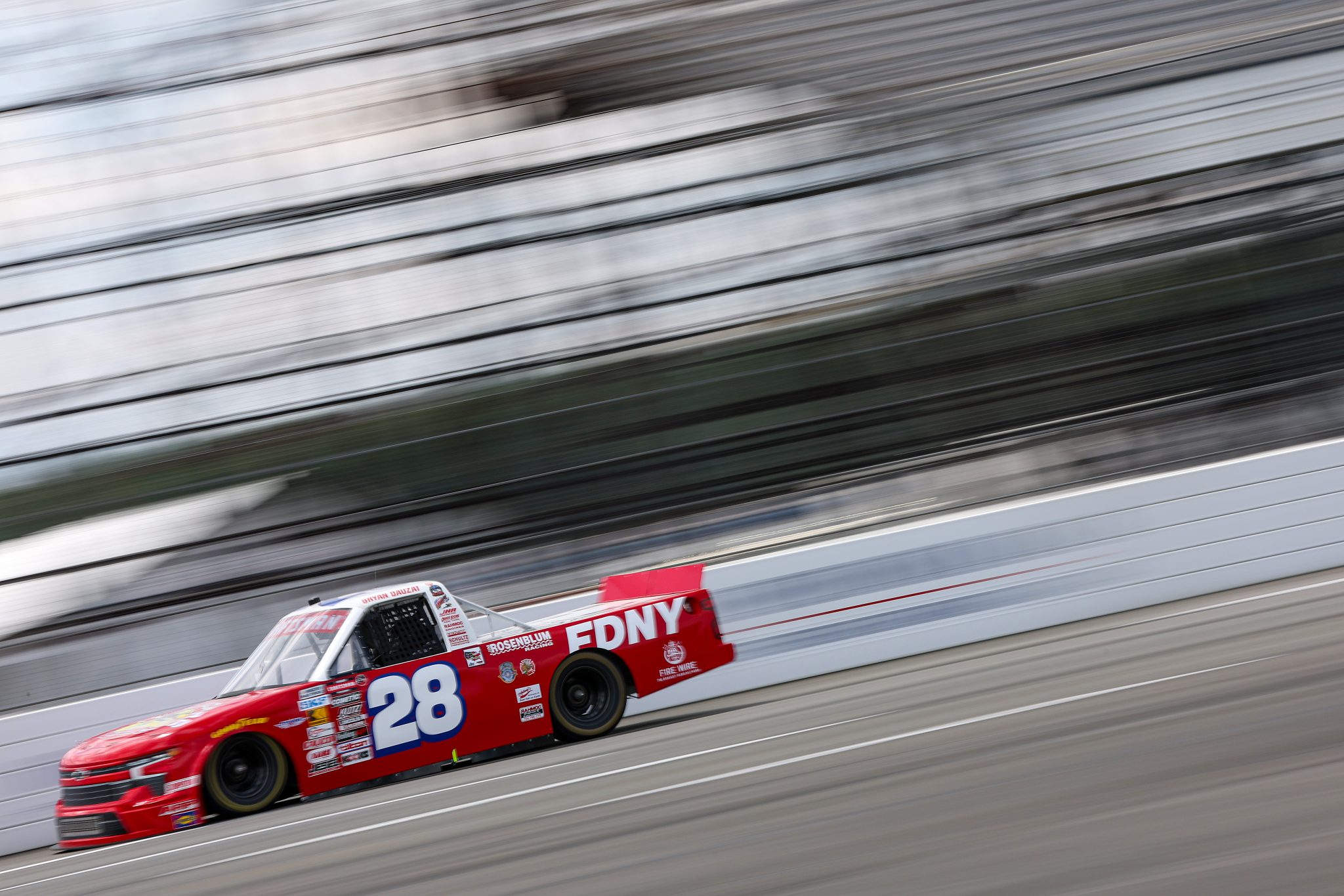 LONG POND, PENNSYLVANIA - JUNE 20: Bryan Dauzat, driver of the #28 FDNY Chevrolet, drives during practice for the NASCAR Craftsman Truck Series MillerTech Battery 200 at Pocono Raceway on June 20, 2025 in Long Pond, Pennsylvania. (Photo by Meg Oliphant/Getty Images) | Getty Images