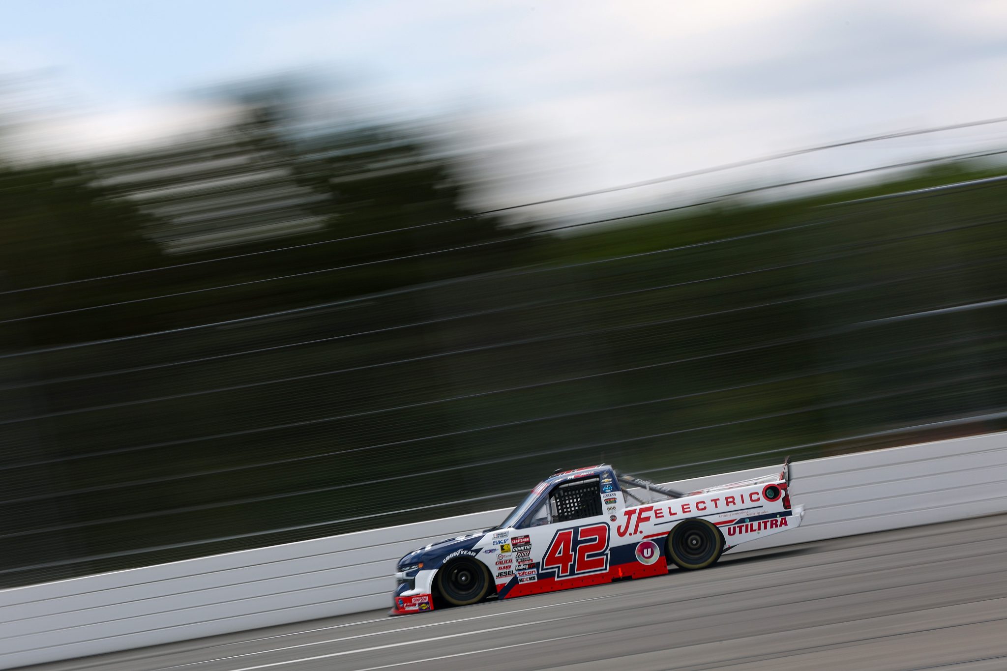 LONG POND, PENNSYLVANIA - JUNE 20: Matt Mills, driver of the #42 J.F. Electric/Utilitra Chevrolet, drives during practice for the NASCAR Craftsman Truck Series MillerTech Battery 200 at Pocono Raceway on June 20, 2025 in Long Pond, Pennsylvania. (Photo by Meg Oliphant/Getty Images) | Getty Images