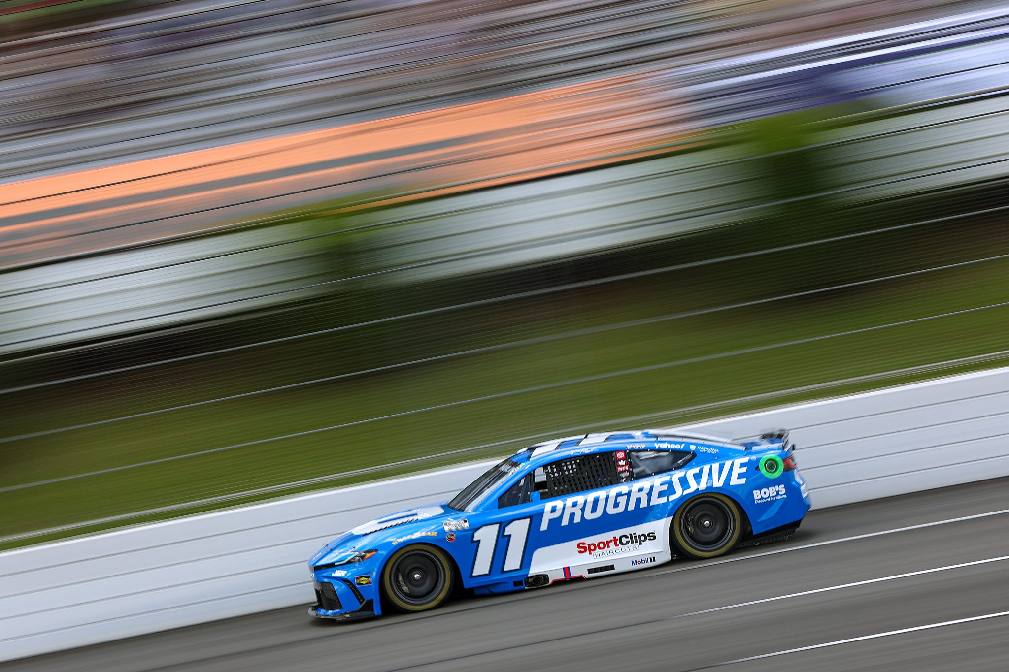 LONG POND, PENNSYLVANIA - JUNE 21: Denny Hamlin, driver of the #11 Progressive Toyota, drives during qualifying for the NASCAR Cup Series The Great American Getaway 400 at Pocono Raceway on June 21, 2025 in Long Pond, Pennsylvania. (Photo by Meg Oliphant/Getty Images) | Getty Images