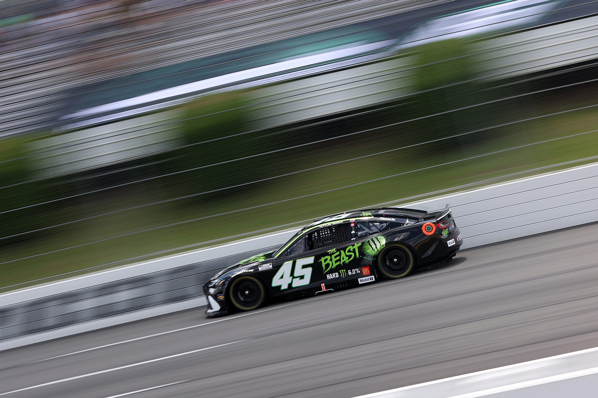 LONG POND, PENNSYLVANIA - JUNE 21: Tyler Reddick, driver of the #45 The Beast Toyota, drives during qualifying for the NASCAR Cup Series The Great American Getaway 400 at Pocono Raceway on June 21, 2025 in Long Pond, Pennsylvania. (Photo by Meg Oliphant/Getty Images) | Getty Images