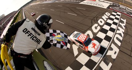LONG POND, PENNSYLVANIA - JUNE 21: Connor Zilisch, driver of the #88 Registix Chevrolet, takes the checkered flag to win the NASCAR Xfinity Series Explore the Pocono Mountains 250 at Pocono Raceway on June 21, 2025 in Long Pond, Pennsylvania. (Photo by Meg Oliphant/Getty Images) | Getty Images