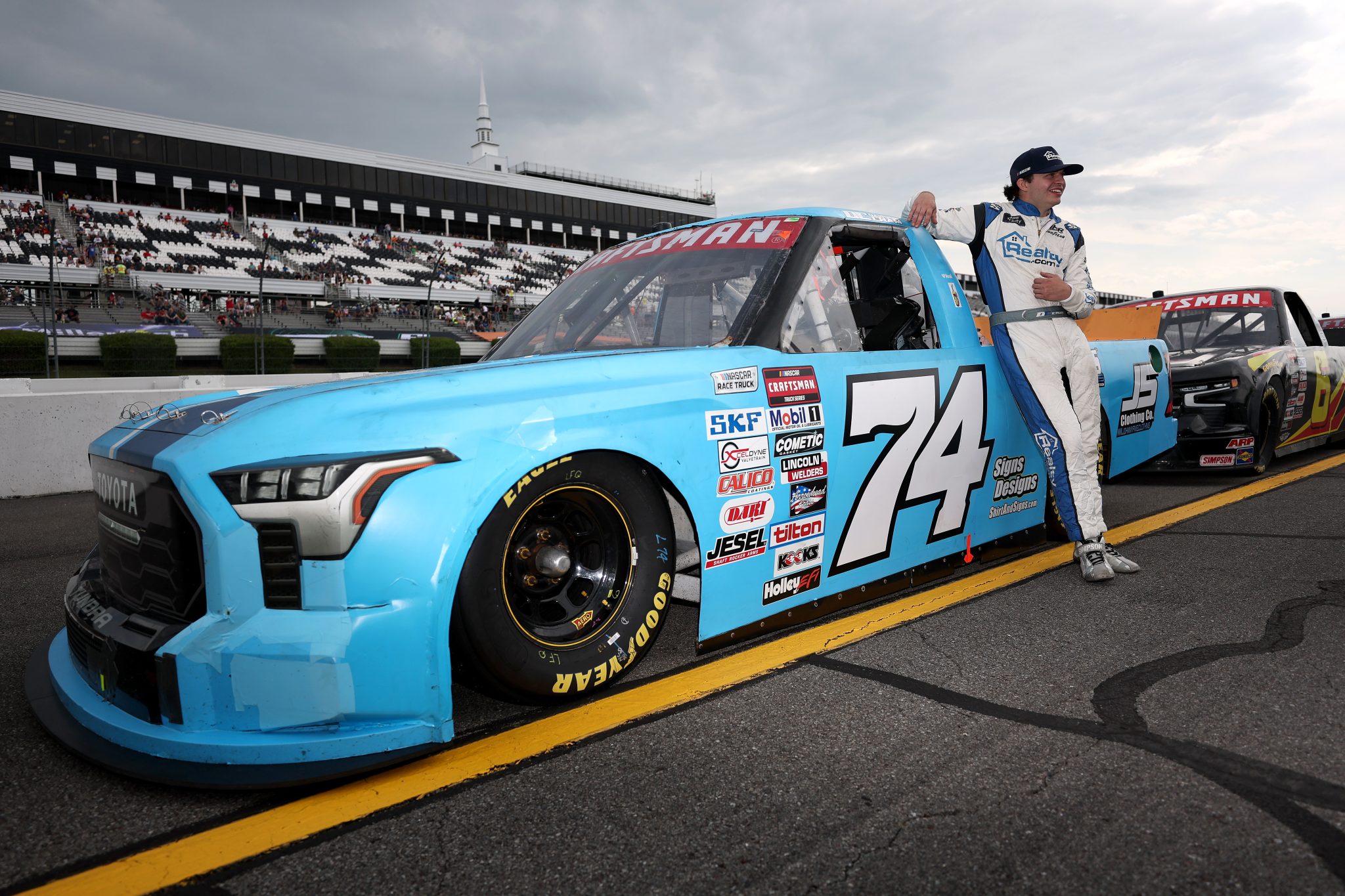 LONG POND, PENNSYLVANIA - JUNE 20: Dawson Cram, driver of the #74 Mike Harmon Racing Toyota, waits on the grid prior to the NASCAR Craftsman Truck Series MillerTech Battery 200 at Pocono Raceway on June 20, 2025 in Long Pond, Pennsylvania. (Photo by Meg Oliphant/Getty Images) | Getty Images