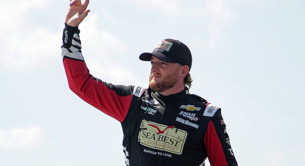 LONG POND, PENNSYLVANIA - JUNE 22: Ty Dillon, driver of the #10 Sea Best Chevrolet, waves to fans as he walks onstage during driver intros prior to the NASCAR Cup Series The Great American Getaway 400 at Pocono Raceway on June 22, 2025 in Long Pond, Pennsylvania. (Photo by Jonathan Bachman/Getty Images) | Getty Images