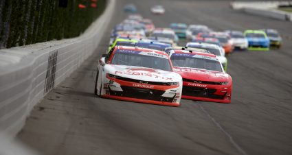 LONG POND, PENNSYLVANIA - JUNE 21: Connor Zilisch, driver of the #88 Registix Chevrolet, and Jesse Love, driver of the #2 Whelen Chevrolet, race during the NASCAR Xfinity Series Explore the Pocono Mountains 250 at Pocono Raceway on June 21, 2025 in Long Pond, Pennsylvania. (Photo by Jonathan Bachman/Getty Images) | Getty Images