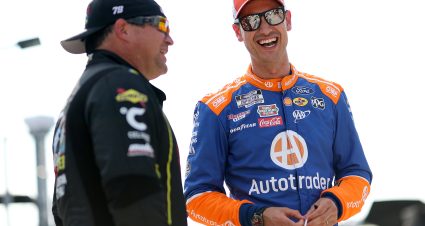 HAMPTON, GEORGIA - JUNE 27: Joey Logano, driver of the #22 Autotrader Ford, (R) and BJ McLeod, driver of the #78 Pigeon Forge Racing Coaster Chevrolet, talk on the grid during qualifying for the NASCAR Cup Series Quaker State 400 Available at Walmart at Echo Park Speedway on June 27, 2025 in Hampton, Georgia. (Photo by Krista Jasso/Getty Images) | Getty Images
