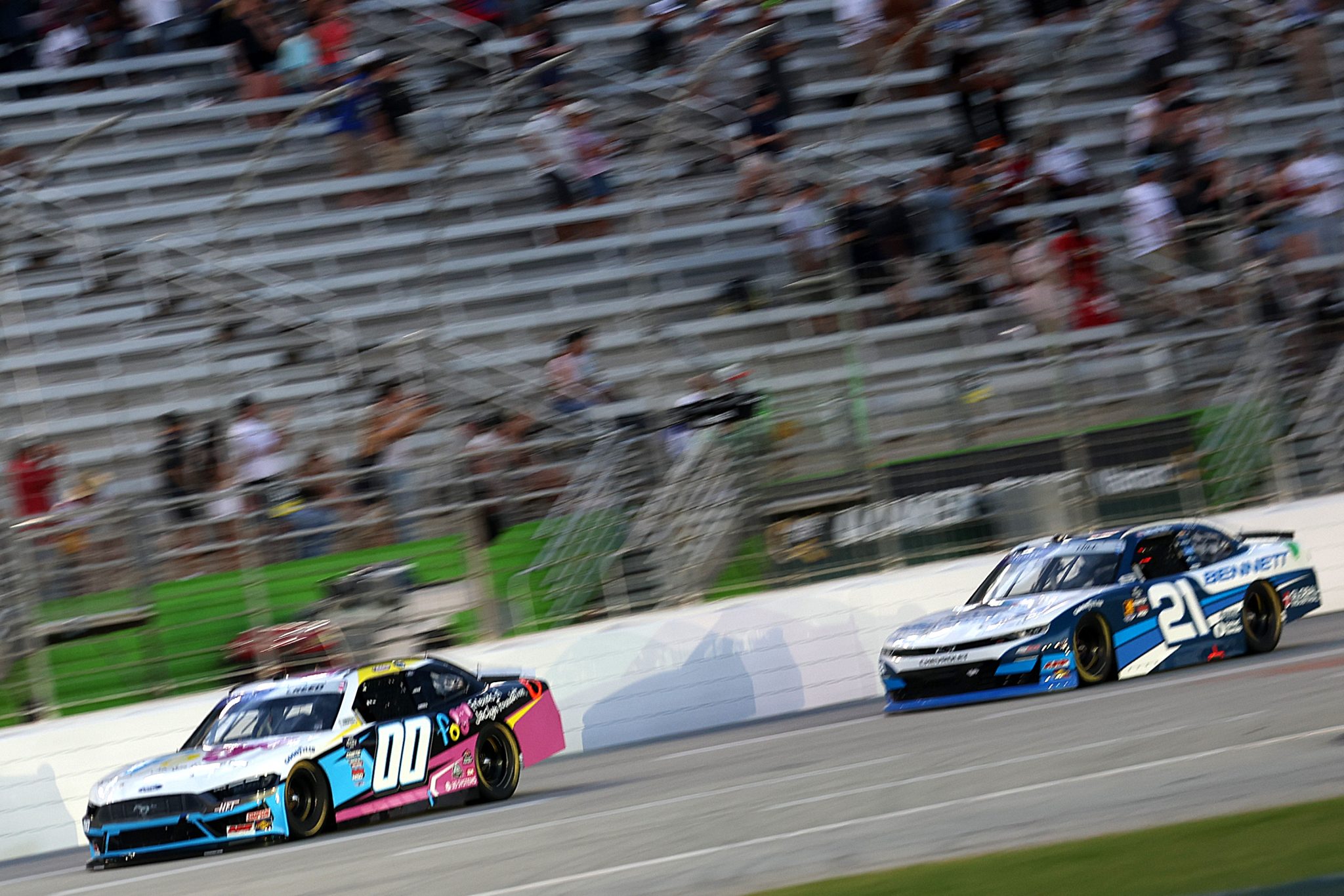 HAMPTON, GEORGIA - JUNE 27: Sheldon Creed, driver of the #00 Friends of Jaclyn Ford, and Austin Hill, driver of the #21 Bennett Transportation Chevrolet, race during the NASCAR Xfinity Series Focused Health 250 at Echo Park Speedway on June 27, 2025 in Hampton, Georgia. (Photo by Krista Jasso/Getty Images) | Getty Images