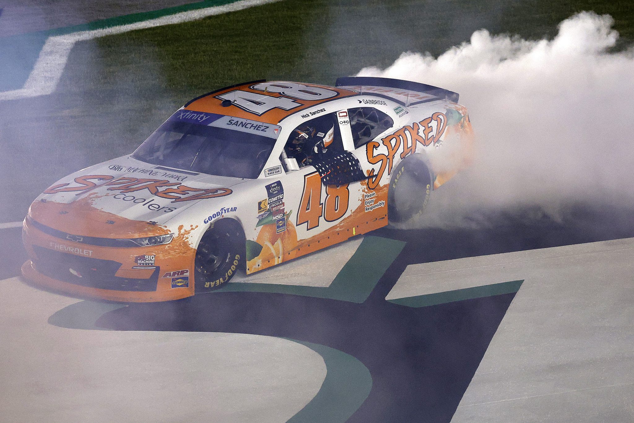 HAMPTON, GEORGIA - JUNE 27: Nick Sanchez, driver of the #48 Big Machine Spiked Coolers Chevrolet, celebrates with a burnout after winning the NASCAR Xfinity Series Focused Health 250 at Echo Park Speedway on June 27, 2025 in Hampton, Georgia. (Photo by Sean Gardner/Getty Images) | Getty Images