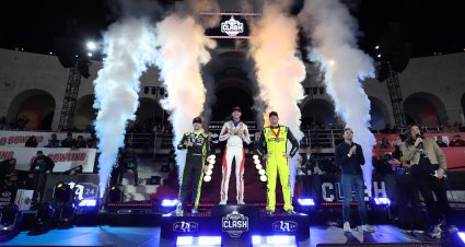 LOS ANGELES, CALIFORNIA - FEBRUARY 03: Denny Hamlin, driver of the #11 Sport Clips Haircuts Toyota, winner (C) Kyle Busch, driver of the #8 Morgan & Morgan Chevrolet, (R) second place and Ryan Blaney, driver of the #12 Menards/Great Lakes Flooring Ford, third place pose on the podium in victory lane after the NASCAR Cup Series Busch Light Clash at The Coliseum at Los Angeles Memorial Coliseum on February 03, 2024 in Los Angeles, California. (Photo by Meg Oliphant/Getty Images) | Getty Images