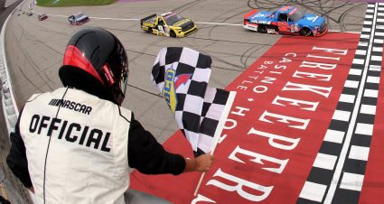 BROOKLYN, MICHIGAN - JUNE 07: Stewart Friesen, driver of the #52 Halmar International Toyota, takes the checkered flag to win the NASCAR Craftsman Truck Series DQS Solutions & Staffing 250 Powered by Precision Vehicle Logistics at Michigan International Speedway on June 07, 2025 in Brooklyn, Michigan. (Photo by Meg Oliphant/Getty Images) | Getty Images