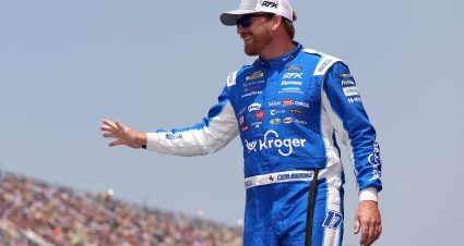 BROOKLYN, MICHIGAN - JUNE 08: Chris Buescher, driver of the #17 Kroger/Kraft/Artesano Ford, waves to fans as he walks onstage during driver intros prior to the NASCAR Cup Series FireKeepers Casino 400 at Michigan International Speedway on June 08, 2025 in Brooklyn, Michigan. (Photo by Meg Oliphant/Getty Images) | Getty Images