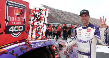 BROOKLYN, MICHIGAN - JUNE 08: Denny Hamlin, driver of the #11 Yahoo! Toyota, poses with the winner sticker on his car in victory lane after winning the NASCAR Cup Series FireKeepers Casino 400 at Michigan International Speedway on June 08, 2025 in Brooklyn, Michigan. (Photo by Meg Oliphant/Getty Images) | Getty Images