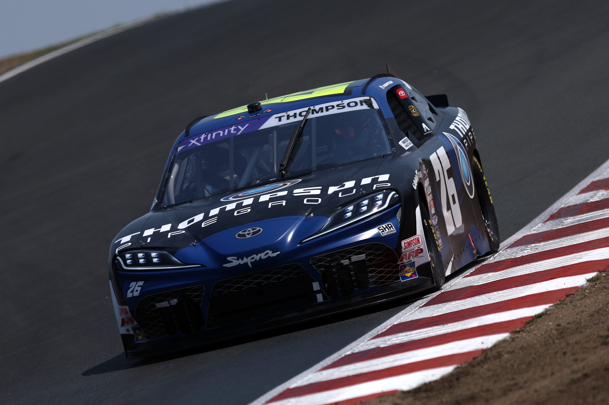 SONOMA, CALIFORNIA - JULY 11: Dean Thompson, driver of the #26 Thompson Pipe Group Toyota, drives during qualifying for the NASCAR Xfinity Series Pit Boss/FoodMaxx 250 at Sonoma Raceway on July 11, 2025 in Sonoma, California. (Photo by Meg Oliphant/Getty Images) | Getty Images
