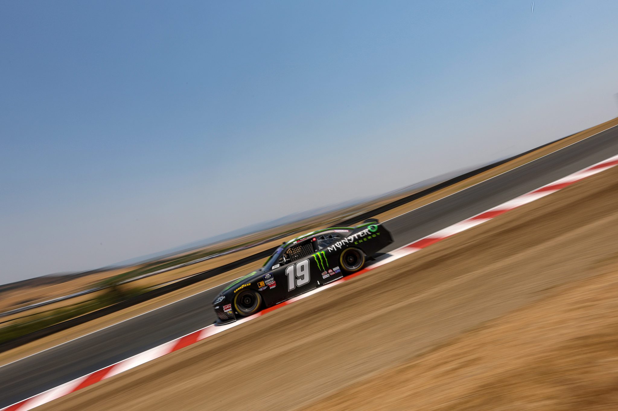 SONOMA, CALIFORNIA - JULY 11: Riley Herbst, driver of the #19 Monster Energy Toyota, drives during qualifying for the NASCAR Xfinity Series Pit Boss/FoodMaxx 250 at Sonoma Raceway on July 11, 2025 in Sonoma, California. (Photo by Meg Oliphant/Getty Images) | Getty Images