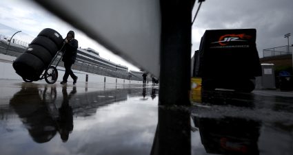 DOVER, DELAWARE - JULY 19: A crew member moves tires during a weather delay in practice for the NASCAR Cup Series AutoTrader EchoPark Automotive 400 at Dover Motor Speedway on July 19, 2025 in Dover, Delaware. (Photo by Sean Gardner/Getty Images) | Getty Images