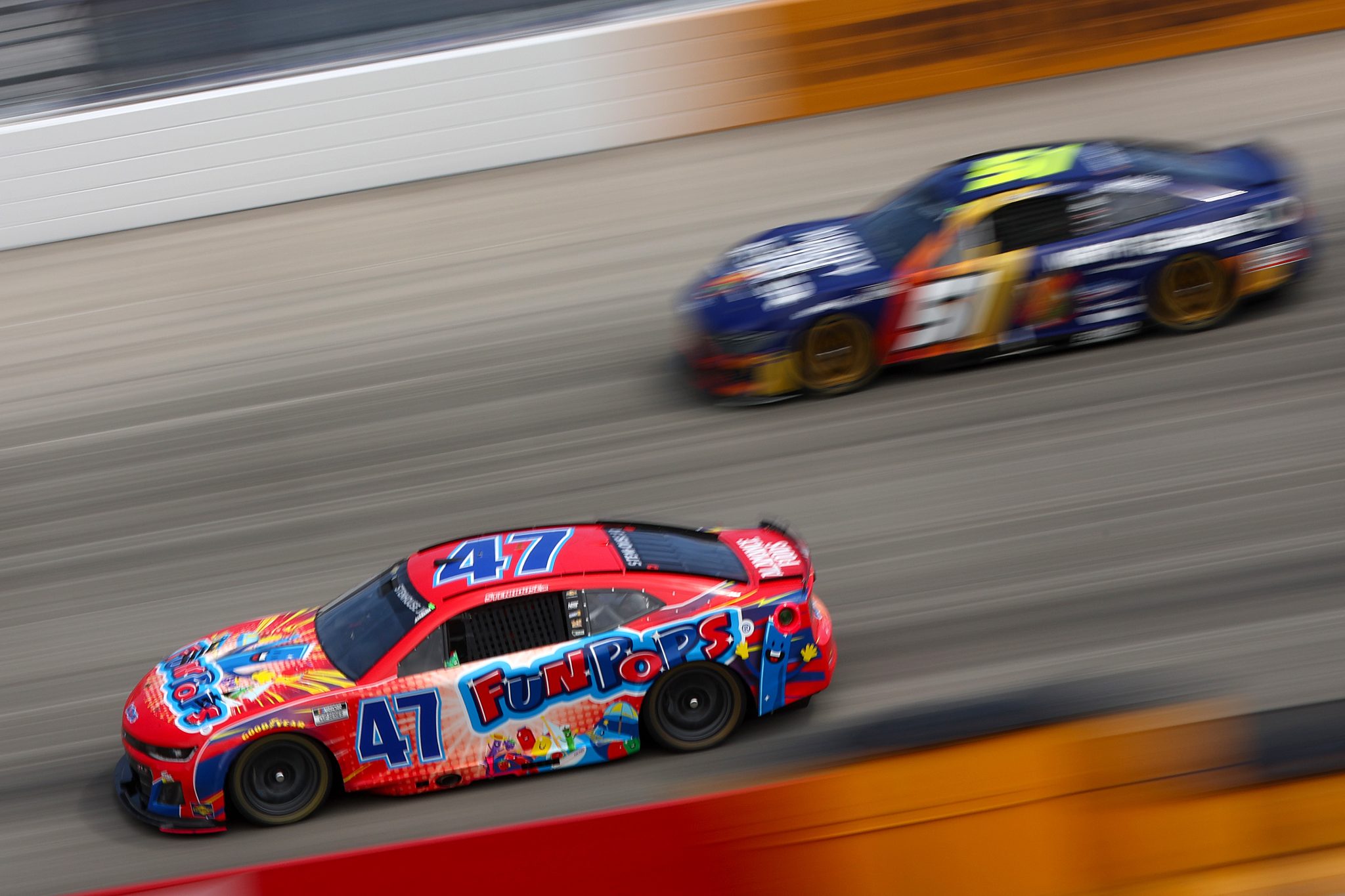 DOVER, DELAWARE - JULY 20: Ricky Stenhouse Jr., driver of the #47 Fun Pops Chevrolet, and Cody Ware, driver of the #51 Mighty Fire Breaker Ford, race during the NASCAR Cup Series AutoTrader EchoPark Automotive 400 at Dover Motor Speedway on July 20, 2025 in Dover, Delaware. (Photo by Meg Oliphant/Getty Images) | Getty Images
