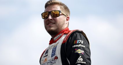 DOVER, DELAWARE - JULY 19: Garrett Smithley, driver of the #14 Camp Barnes Chevrolet, waits backstage during pre-race ceremonies prior to the NASCAR Xfinity Series BetRivers 200 at Dover Motor Speedway on July 19, 2025 in Dover, Delaware. (Photo by Sean Gardner/Getty Images) | Getty Images