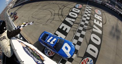DOVER, DELAWARE - JULY 20: Denny Hamlin, driver of the #11 Progressive Toyota, takes the checkered flag to win the NASCAR Cup Series AutoTrader EchoPark Automotive 400 at Dover Motor Speedway on July 20, 2025 in Dover, Delaware. (Photo by Sean Gardner/Getty Images) | Getty Images