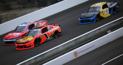 INDIANAPOLIS, INDIANA - JULY 26: Carson Kvapil, driver of the #1 Bass Pro Shops/Clarience Tech Chevrolet, David Starr, driver of the #35 Alarm Tech Systems Inc Chevrolet, and Nicholas Sanchez, driver of the #48 GainBridge Chevrolet, race during the NASCAR Xfinity Series Pennzoil 250 at Indianapolis Motor Speedway on July 26, 2025 in Indianapolis, Indiana. (Photo by Jonathan Bachman/Getty Images) | Getty Images