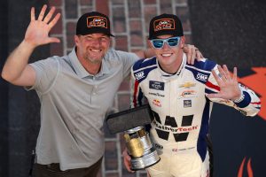 INDIANAPOLIS, INDIANA - JULY 26: Connor Zilisch, driver of the #88 WeatherTech Chevrolet, and Hall of Famer and JR Motorsports team owner, Dale Earnhardt Jr. pose for photos after winning the NASCAR Xfinity Series Pennzoil 250 and JR Motorsports 100th NASCAR Xfinity Series win at Indianapolis Motor Speedway on July 26, 2025 in Indianapolis, Indiana. (Photo by James Gilbert/Getty Images) | Getty Images