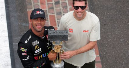 INDIANAPOLIS, INDIANA - JULY 27: Bubba Wallace, driver of the #23 Chumba Casino Toyota, (L) and co-owner of 23XI Racing, Denny Hamlin pose with the Brickyard 400 trophy at the yard of bricks after winning the NASCAR Cup Series Brickyard 400 Presented by PPG at Indianapolis Motor Speedway on July 27, 2025 in Indianapolis, Indiana. (Photo by Jonathan Bachman/Getty Images) | Getty Images