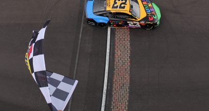 INDIANAPOLIS, INDIANA - JULY 27: Bubba Wallace, driver of the #23 Chumba Casino Toyota, takes the checkered flag to win the NASCAR Cup Series Brickyard 400 Presented by PPG at Indianapolis Motor Speedway on July 27, 2025 in Indianapolis, Indiana. (Photo by Jonathan Bachman/Getty Images) | Getty Images