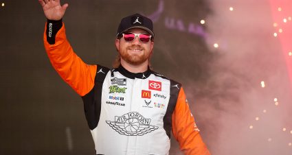 CHICAGO, ILLINOIS - JULY 06: Tyler Reddick, driver of the #45 Jordan Brand Toyota, waves to fans as he walks onstage during driver intros prior to the NASCAR Cup Series Grant Park 165 at Chicago Street Course on July 06, 2025 in Chicago, Illinois. (Photo by James Gilbert/Getty Images) | Getty Images