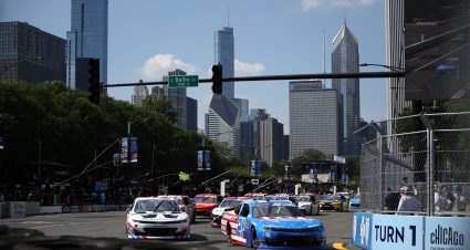CHICAGO, ILLINOIS - JULY 05: Austin Hill, driver of the #21 Bennett Transportation Chevrolet, and Shane Van Gisbergen, driver of the #9 WeatherTech/Red Bull Chevrolet, race during the NASCAR Xfinity Series The Loop 110 at Chicago Street Course on July 05, 2025 in Chicago, Illinois. (Photo by James Gilbert/Getty Images) | Getty Images
