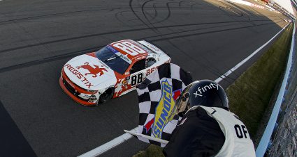 WATKINS GLEN, NEW YORK - AUGUST 09: Connor Zilisch, driver of the #88 Registix Chevrolet, takes the checkered flag to win the NASCAR Xfinity Series Mission 200 at The Glen at Watkins Glen International on August 09, 2025 in Watkins Glen, New York. (Photo by Sean Gardner/Getty Images) | Getty Images