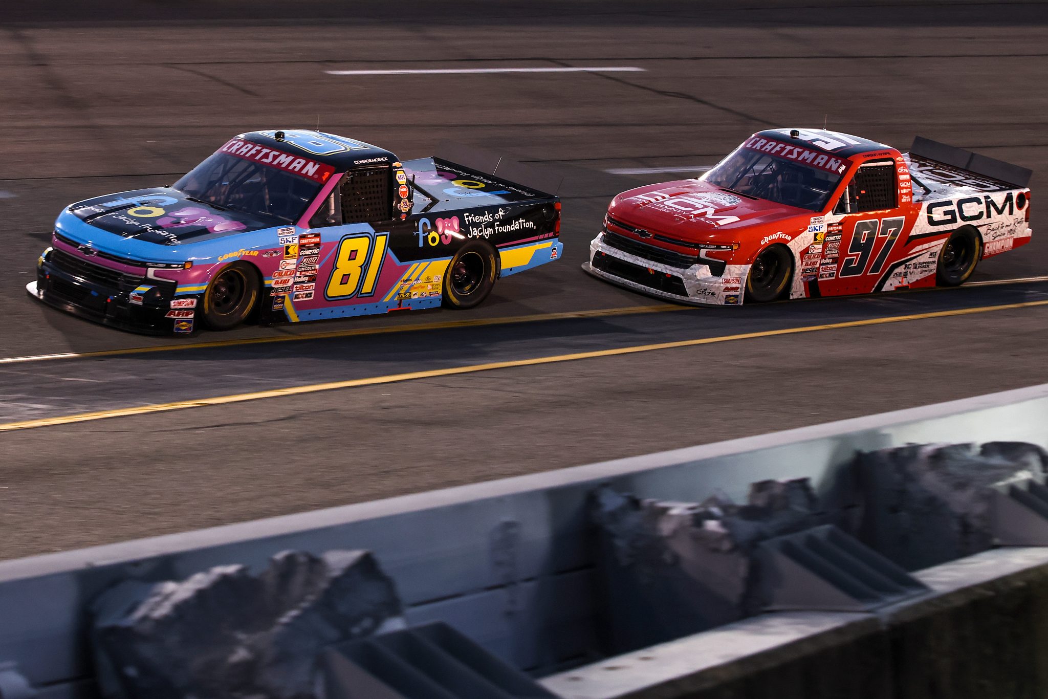 RICHMOND, VIRGINIA - AUGUST 15: Connor Mosack, driver of the #81 Friends of Jaclyn Foundation Chevrolet, and Carson Kvapil, driver of the #97 Grant County Mulch Chevrolet, race during the NASCAR Craftsman Truck Series eero 250 at Richmond Raceway on August 15, 2025 in Richmond, Virginia. (Photo by Samuel Corum/Getty Images) | Getty Images