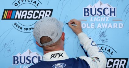 RICHMOND, VIRGINIA - AUGUST 15: Ryan Preece, driver of the #60 Kroger/Kleenex Ford, signs the Busch Light Pole Award backdrop after winning the pole award during qualifying for the NASCAR Cup Series Cook Out 400 - Practice at Richmond Raceway on August 15, 2025 in Richmond, Virginia. (Photo by Chris Graythen/Getty Images) | Getty Images