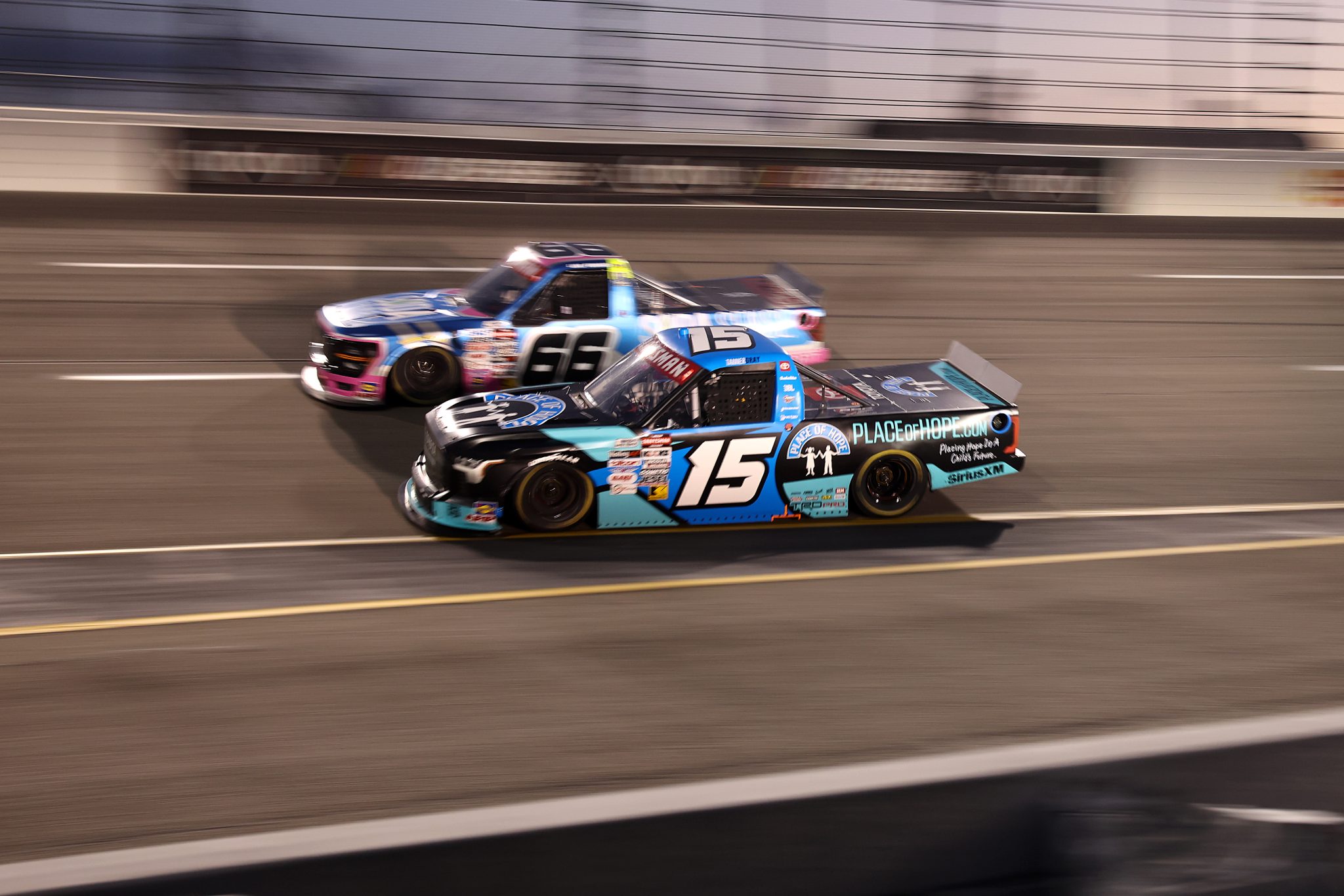 RICHMOND, VIRGINIA - AUGUST 15: Tanner Gray, driver of the #15 Place of Hope Toyota, and Luke Fenhaus, driver of the #66 Soda Sense Ford, race during the NASCAR Craftsman Truck Series eero 250 at Richmond Raceway on August 15, 2025 in Richmond, Virginia. (Photo by Samuel Corum/Getty Images) | Getty Images