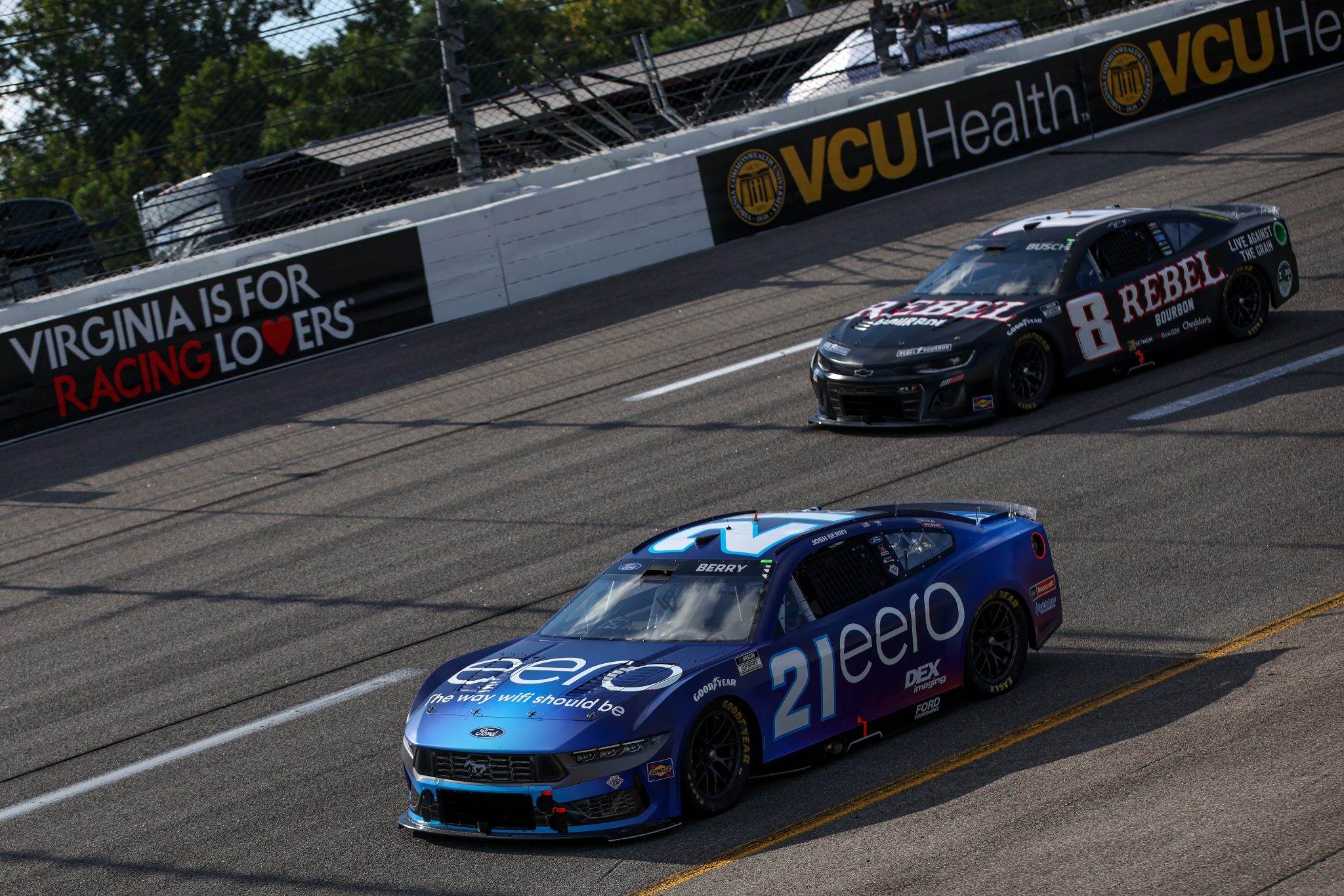 RICHMOND, VIRGINIA - AUGUST 15: Josh Berry, driver of the #21 Eero Ford, and Kyle Busch, driver of the #8 Rebel Bourbon Chevrolet, drive during practice for the NASCAR Cup Series Cook Out 400 - Practice at Richmond Raceway on August 15, 2025 in Richmond, Virginia. (Photo by Samuel Corum/Getty Images) | Getty Images