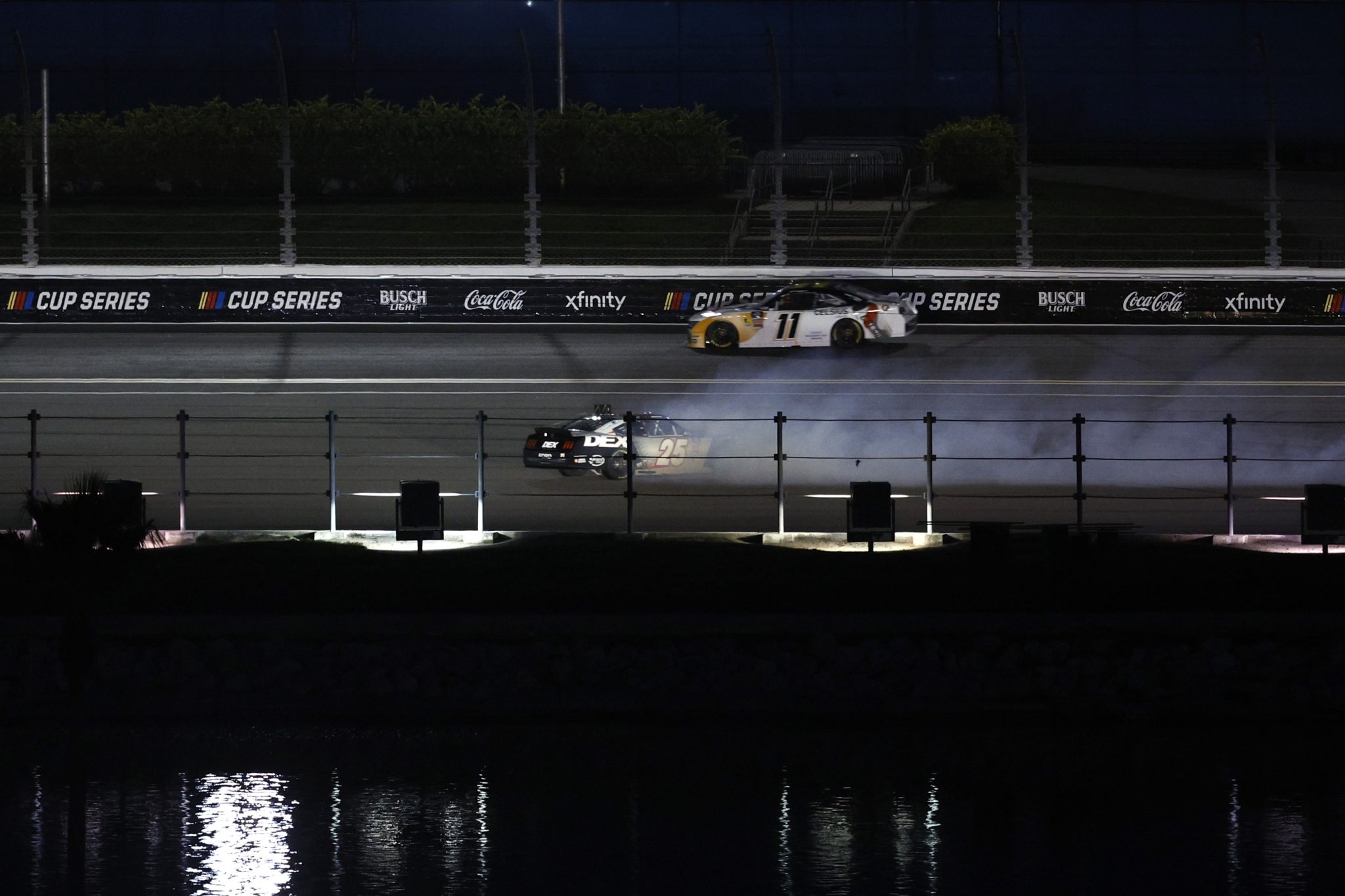 DAYTONA BEACH, FLORIDA - AUGUST 22: Harrison Burton, driver of the #25 DEX Imaging Ford, spins during the NASCAR Xfinity Series Wawa 250 Powered By Coca-Cola at Daytona International Speedway on August 22, 2025 in Daytona Beach, Florida. (Photo by Sean Gardner/Getty Images) | Getty Images