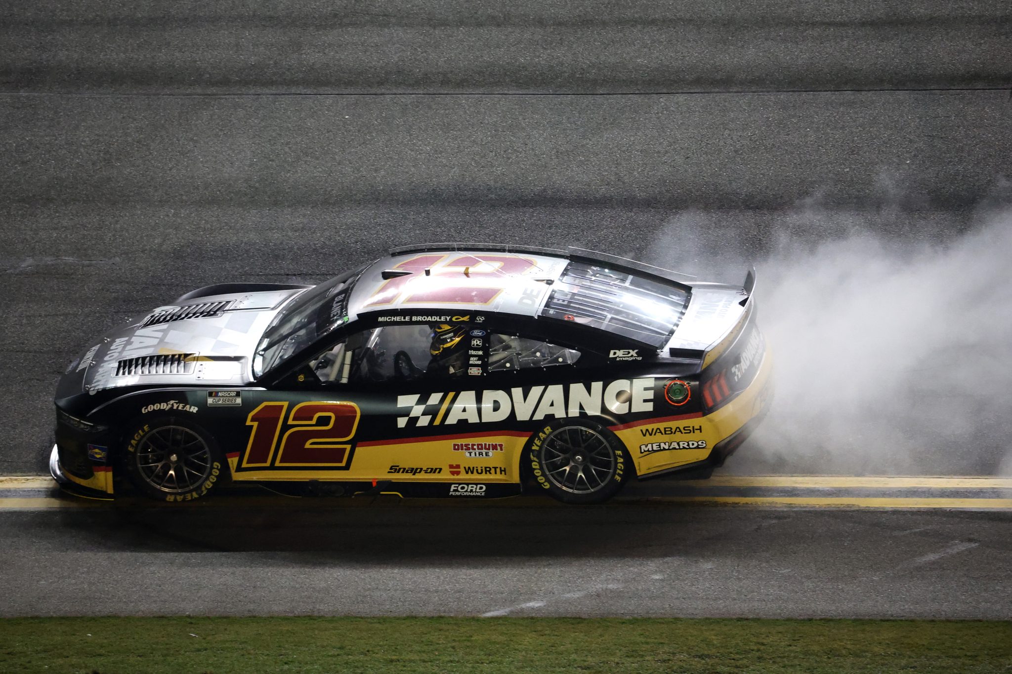 DAYTONA BEACH, FLORIDA - AUGUST 23: Ryan Blaney, driver of the #12 Advance Auto Parts Ford, celebrates with a burnout after winning the NASCAR Cup Series Coke Zero Sugar 400 at Daytona International Speedway on August 23, 2025 in Daytona Beach, Florida. (Photo by Chris Graythen/Getty Images) | Getty Images