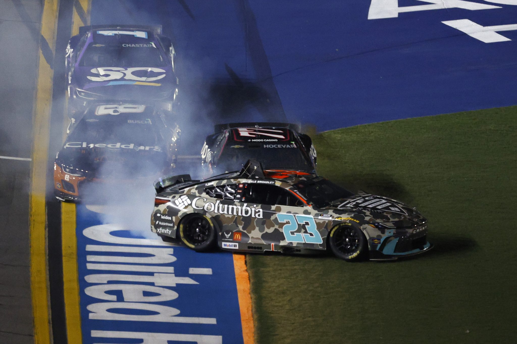 DAYTONA BEACH, FLORIDA - AUGUST 23: Bubba Wallace, driver of the #23 Columbia Toyota, and Kyle Busch, driver of the #8 Cheddar's Scratch Kitchen Chevrolet, are involved in an incident during the NASCAR Cup Series Coke Zero Sugar 400 at Daytona International Speedway on August 23, 2025 in Daytona Beach, Florida. (Photo by Sean Gardner/Getty Images) | Getty Images