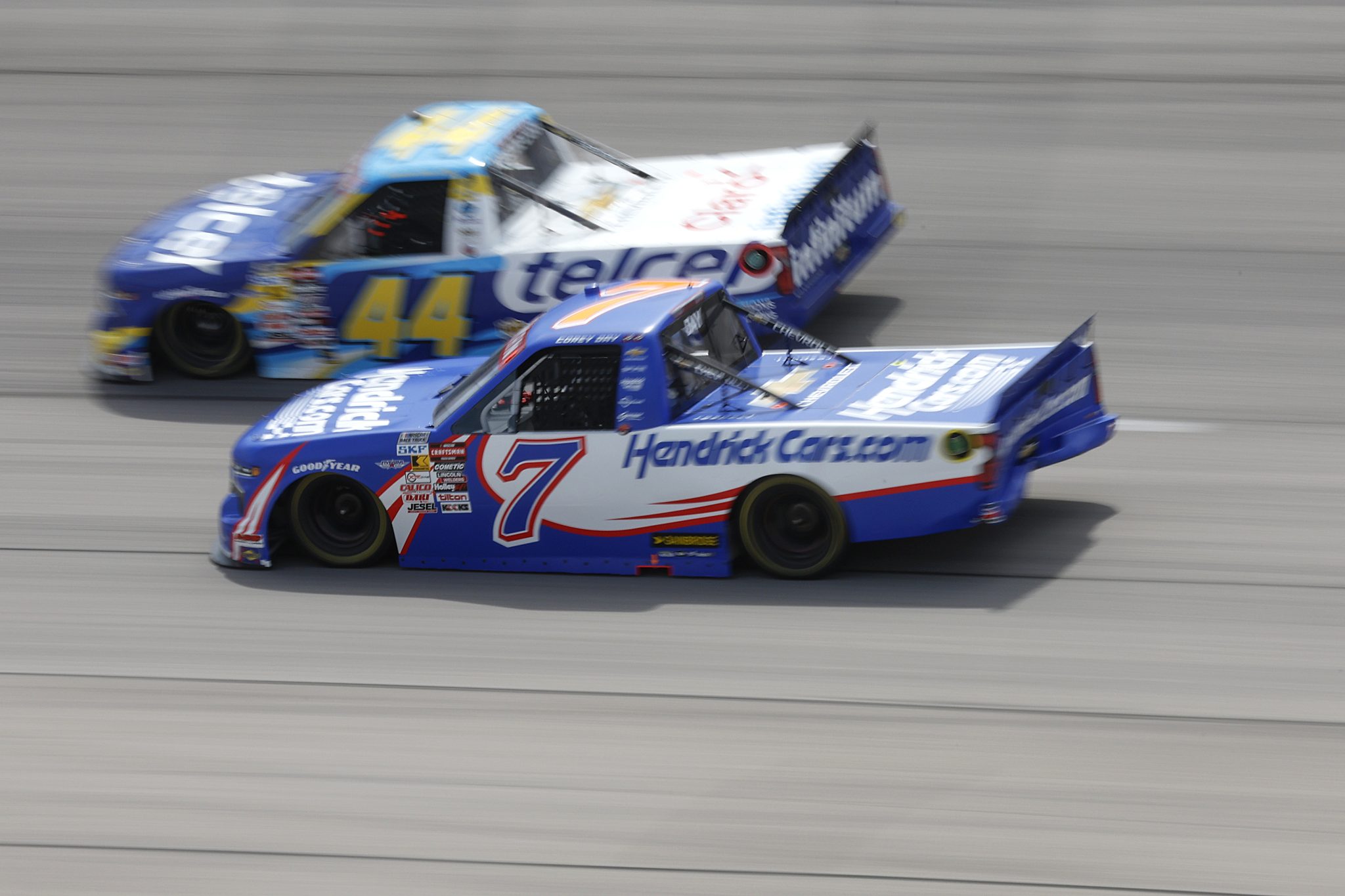 DARLINGTON, SOUTH CAROLINA - AUGUST 30: Corey Day, driver of the #7 HendrickCars.com Chevrolet, and Andres Perez De Lara, driver of the #44 Telcel Chevrolet, race during the NASCAR Craftsman Truck Series Sober or Slammer 200 at Darlington Raceway on August 30, 2025 in Darlington, South Carolina. (Photo by Logan Riely/Getty Images) | Getty Images