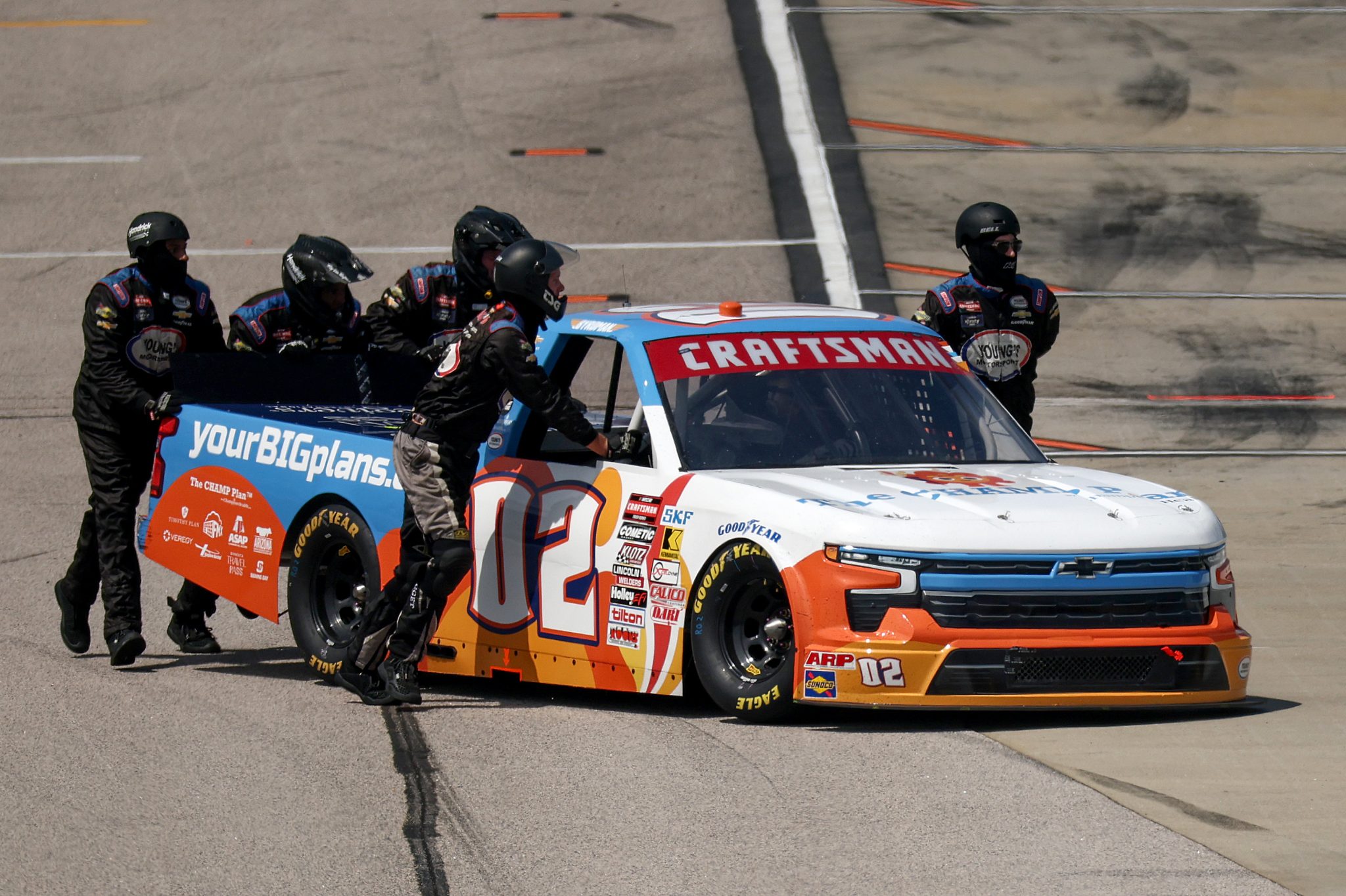 DARLINGTON, SOUTH CAROLINA - AUGUST 30: Crew members push the #02 Champion Health Chevrolet, driven by Nathan Byrd off track after an incident during the NASCAR Craftsman Truck Series Sober or Slammer 200 at Darlington Raceway on August 30, 2025 in Darlington, South Carolina. (Photo by Jared C. Tilton/Getty Images) | Getty Images