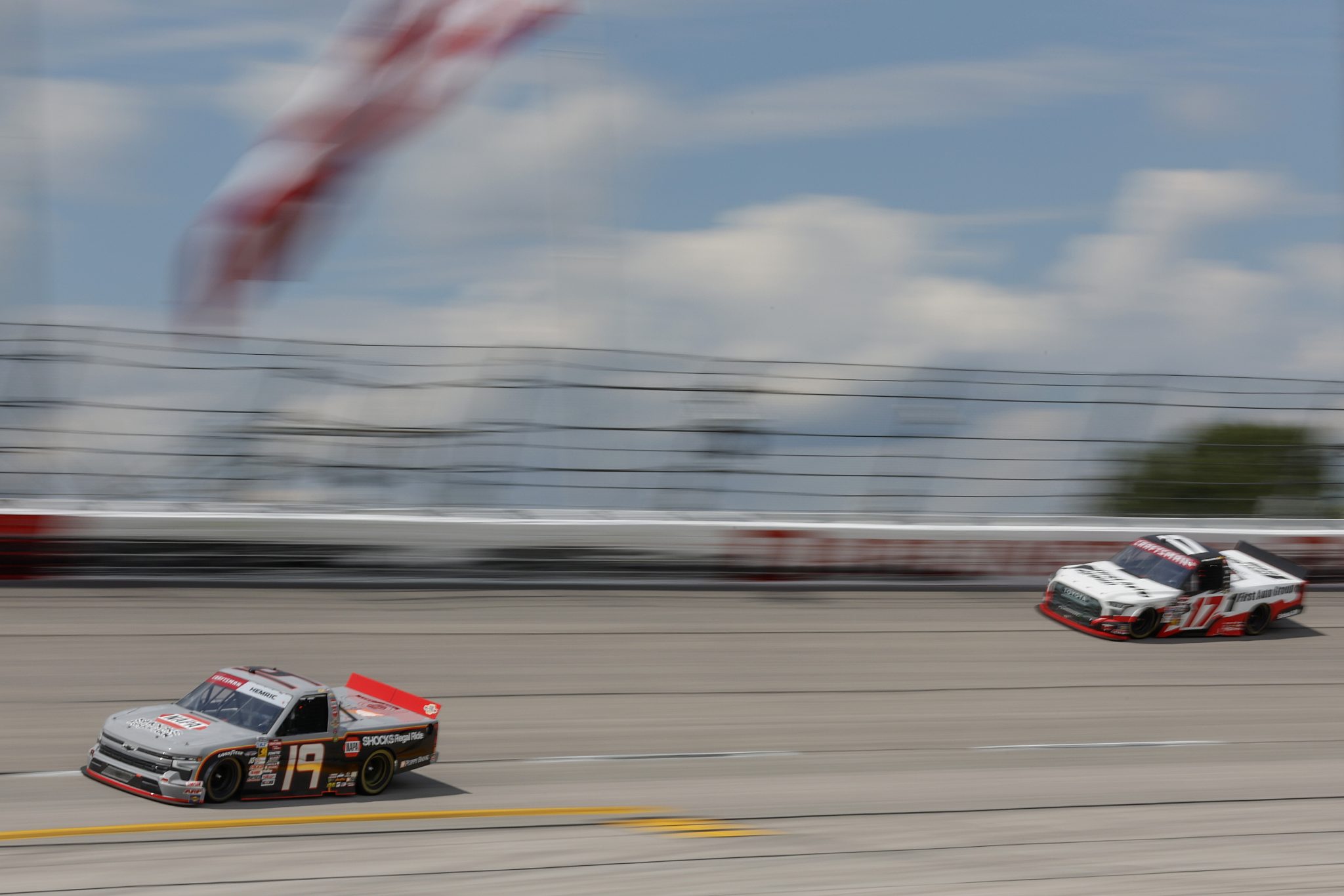 DARLINGTON, SOUTH CAROLINA - AUGUST 30: Daniel Hemric, driver of the #19 NAPA Chevrolet, and Giovanni Ruggiero, driver of the #17 First Auto Group Toyota, race during the NASCAR Craftsman Truck Series Sober or Slammer 200 at Darlington Raceway on August 30, 2025 in Darlington, South Carolina. (Photo by Logan Riely/Getty Images) | Getty Images