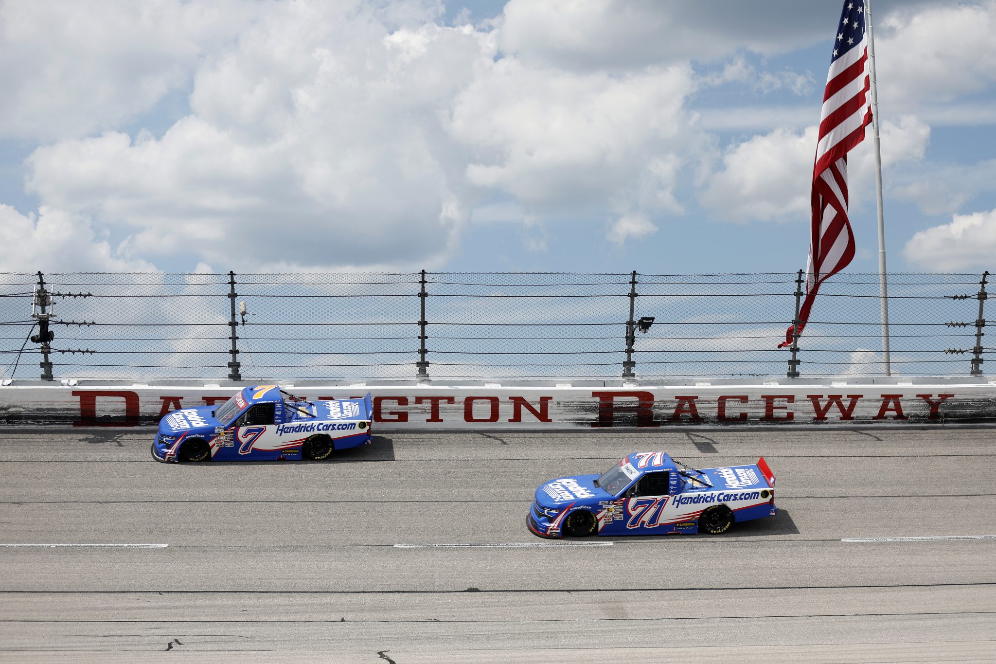 DARLINGTON, SOUTH CAROLINA - AUGUST 30: Corey Day, driver of the #7 HendrickCars.com Chevrolet, and Rajah Caruth, driver of the #71 HendrickCars.com Chevrolet, race during the NASCAR Craftsman Truck Series Sober or Slammer 200 at Darlington Raceway on August 30, 2025 in Darlington, South Carolina. (Photo by Logan Riely/Getty Images) | Getty Images