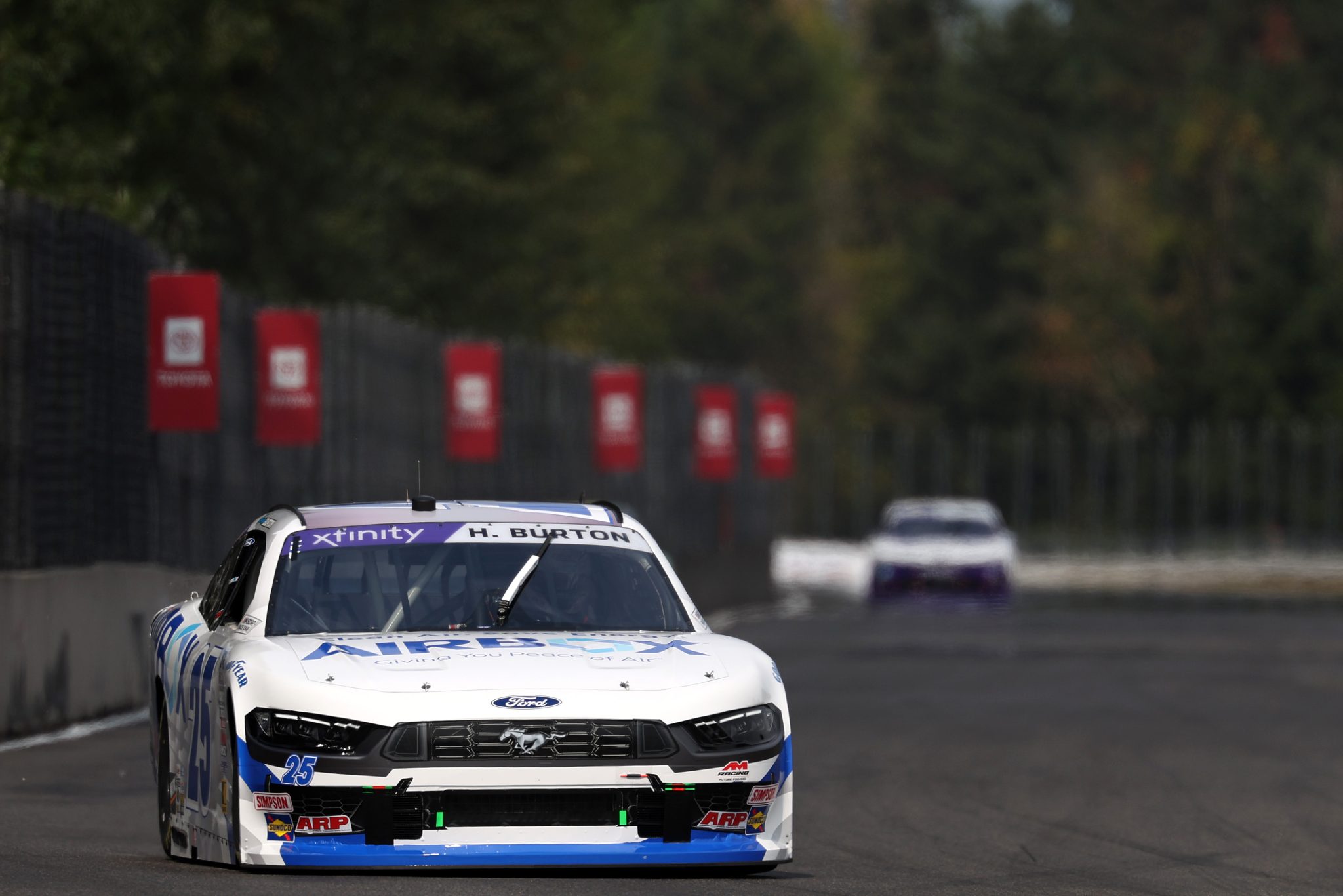 PORTLAND, OREGON - AUGUST 30: Harrison Burton, driver of the #25 AirBox Ford, drives during practice for the NASCAR Xfinity Series Pacific Office Automation 147 at Portland International Raceway on August 30, 2025 in Portland, Oregon. (Photo by David Jensen/Getty Images) | Getty Images