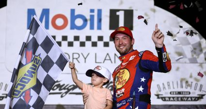 DARLINGTON, SOUTH CAROLINA - AUGUST 31: Chase Briscoe, driver of the #19 Bass Pro Shops Toyota, celebrates with his son, Brooks Briscoe in victory lane after winning the NASCAR Cup Series Cook Out Southern 500 at Darlington Raceway on August 31, 2025 in Darlington, South Carolina. (Photo by Jared C. Tilton/Getty Images) | Getty Images