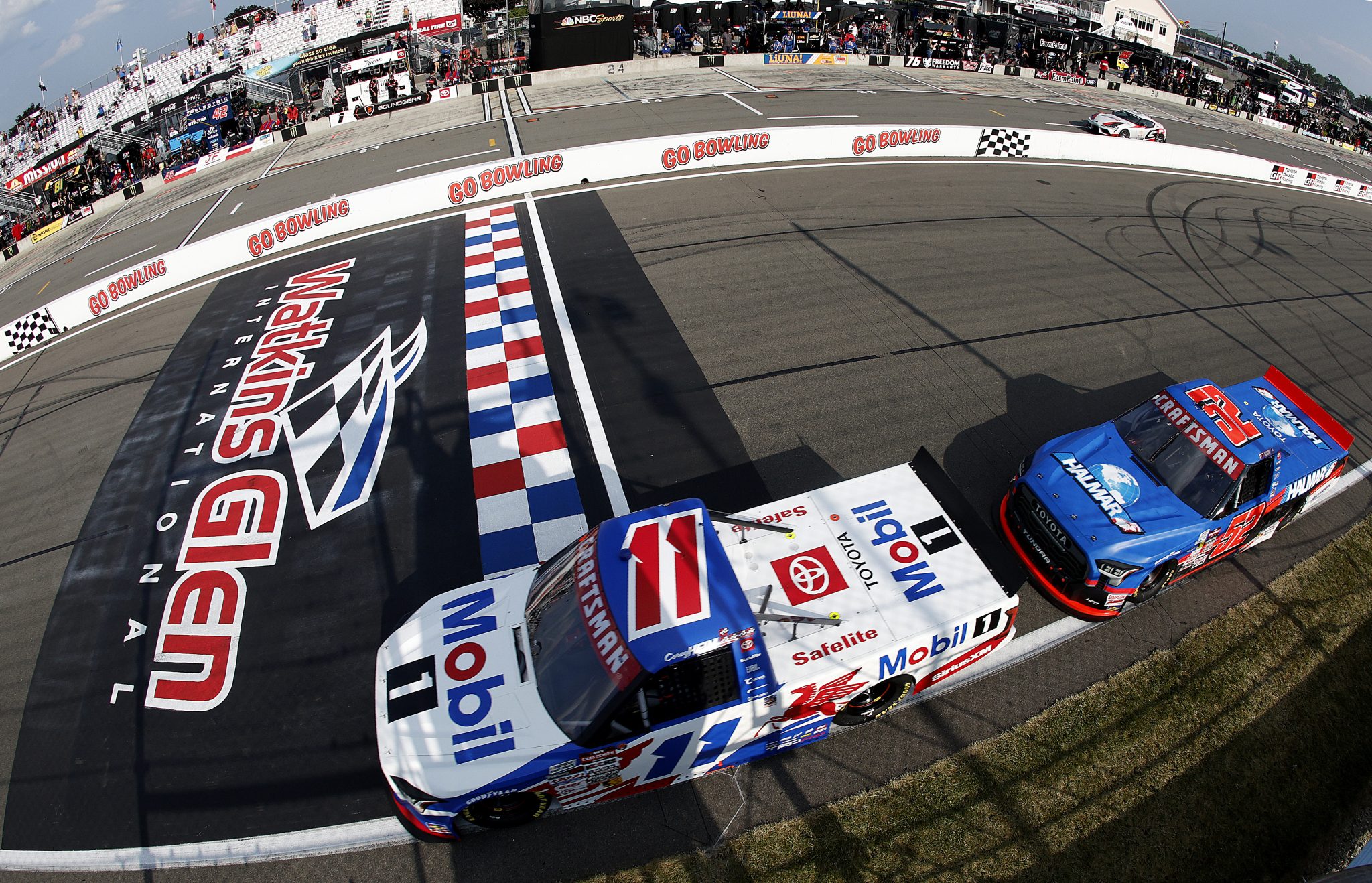 WATKINS GLEN, NEW YORK - AUGUST 08: Corey Heim, driver of the #11 Mobil 1 Toyota, leads Christopher Bell, driver of the #52 Halmar International Toyota, to start the NASCAR Craftsman Truck Series Mission 176 at The Glen at Watkins Glen International on August 08, 2025 in Watkins Glen, New York. (Photo by Sean Gardner/Getty Images) | Getty Images