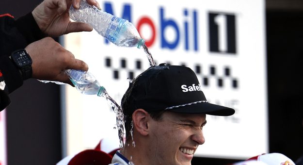 WATKINS GLEN, NEW YORK - AUGUST 08: Corey Heim, driver of the #11 Mobil 1 Toyota, is doused with water in victory lane after winning  the NASCAR Craftsman Truck Series Mission 176 at The Glen at Watkins Glen International on August 08, 2025 in Watkins Glen, New York. (Photo by Sean Gardner/Getty Images) | Getty Images