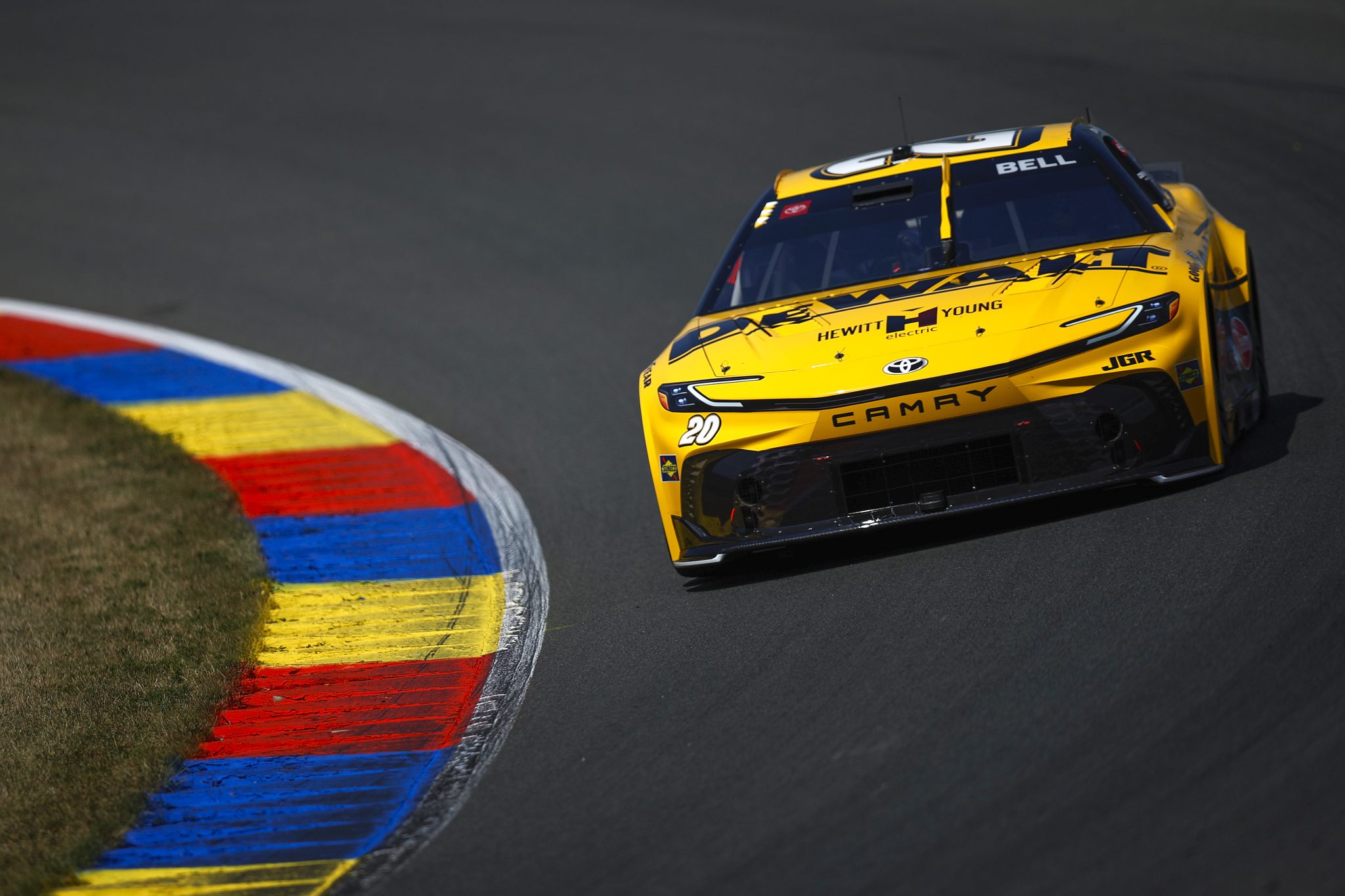 WATKINS GLEN, NEW YORK - AUGUST 09: Christopher Bell, driver of the #20 DEWALT Toyota, drives during practice for the NASCAR Cup Series Go Bowling at The Glen at Watkins Glen International on August 09, 2025 in Watkins Glen, New York. (Photo by Sean Gardner/Getty Images) | Getty Images