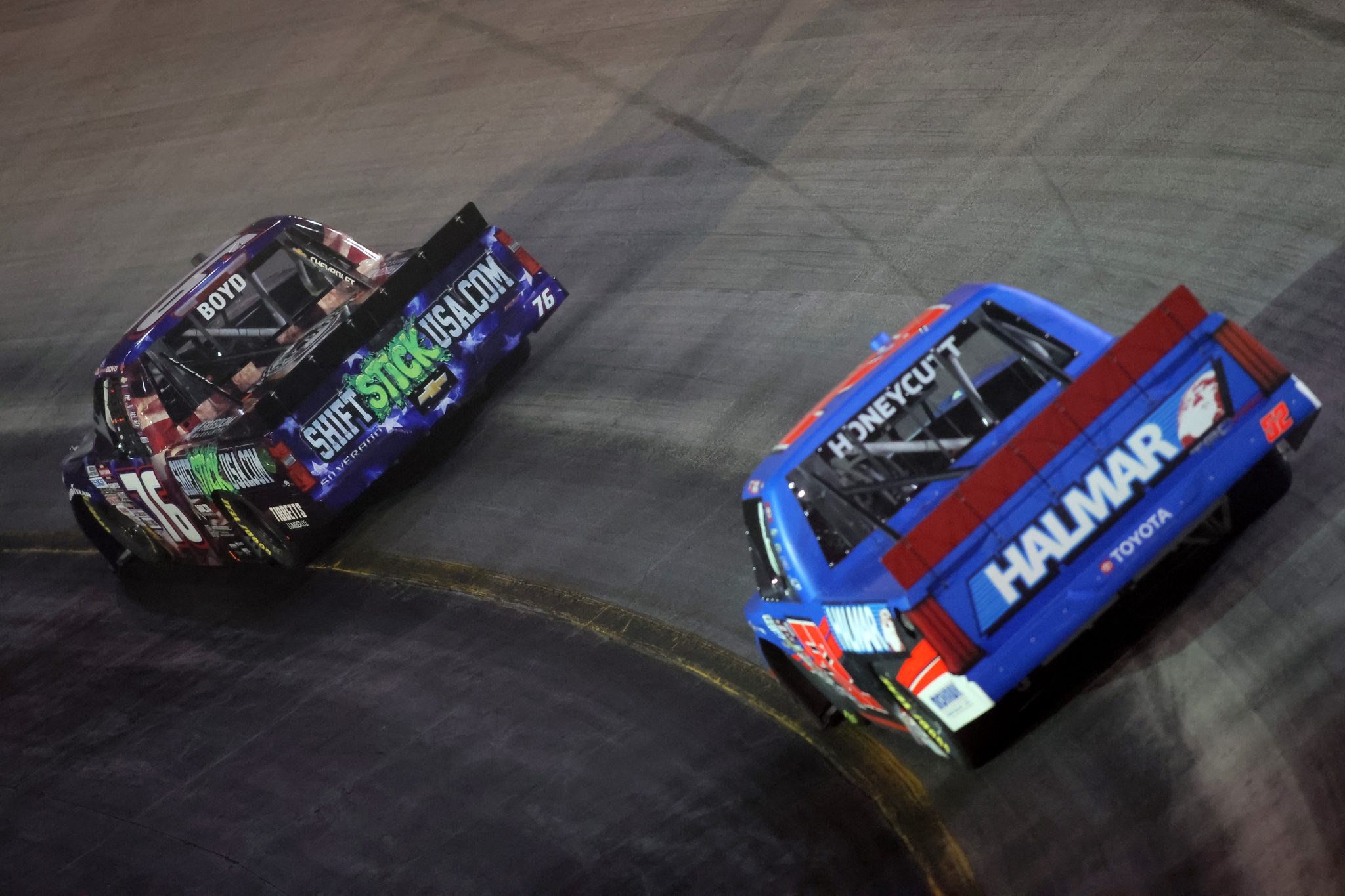 BRISTOL, TENNESSEE - SEPTEMBER 11: Spencer Boyd, driver of the #76 ShiftStickUSA.com Chevrolet, and Kaden Honeycutt, driver of the #52 Halmar International Toyota, race during the NASCAR Craftsman Truck Series UNOH 200 presented by Ohio Logistics at Bristol Motor Speedway on September 11, 2025 in Bristol, Tennessee. (Photo by Jonathan Bachman/Getty Images) | Getty Images